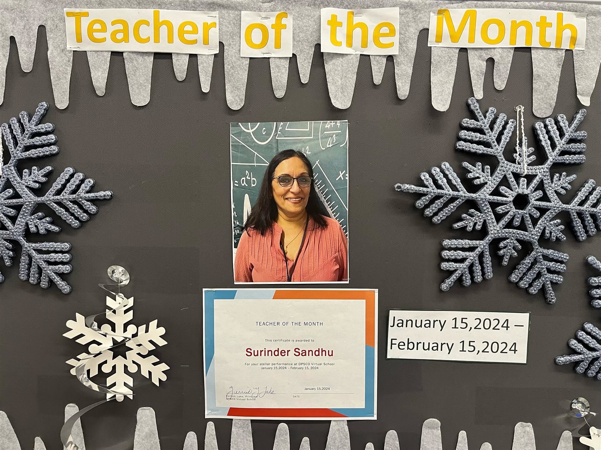 Ms. Sandhu on the Teacher of the Month board
